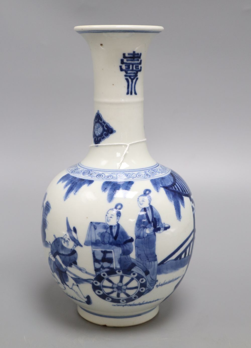 A Chinese blue and white figurative bottle vase, with four character mark to base, height 26cm